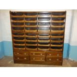 AN ANTIQUE OAK HABERDASHERY UNIT CUPBOARD, 180 CM WIDE