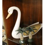 A CARVED WOOD HARRODS SWAN ALONG WITH A PAIR OF NOVELTY PALM TREE CANDLESTICKS