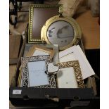 A BOX OF PICTURE FRAMES WITH A BRASS PORTHOLE MIRROR