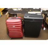 TWO MODERN SUITCASES ON WHEELS