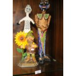 TWO PAPIER MACHE FIGURES AND A CAST IRON DOOR STOP