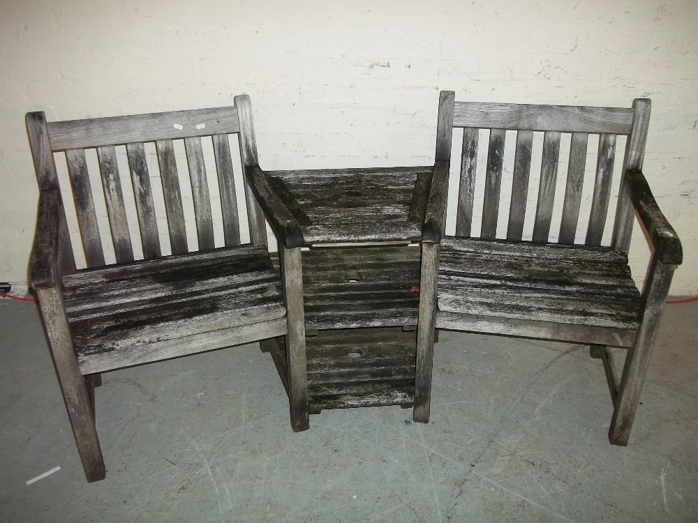 A WOODEN GARDEN LOVE SEAT