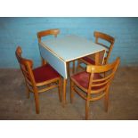 A RETRO DROP LEAF FORMICA KITCHEN TABLE AND FOUR POLISH CHAIRS