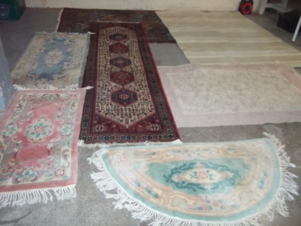 A SELECTION OF SEVEN RUGS