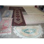 A SELECTION OF SEVEN RUGS