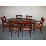 AN EXTENDING INLAID DINING SET TABLE AND SIX CHAIRS TO INCLUDE TWO CARVERS