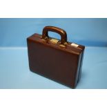 A LEATHER ATTACHE CASE