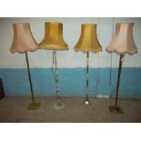 FOUR FLOOR STANDING STANDARD LAMPS AND SHADES, ONE IN BRASS