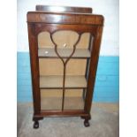 A NARROW LOCKING CHINA CABINET MADE BY THOMAS CLARKSON & SONS, WOLVERHAMPTON
