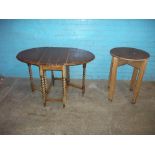 TWO ANTIQUE TABLES COMPRISING A BARLEY TWIST OAK DROP LEAF TABLE AND AN OAK CIRCULAR PUB TYPE TABLE