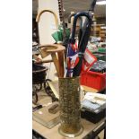 A BRASS STICK STAND ALONG WITH SIX UMBRELLAS AND TWO WALKING STICKS AND A SET SQUARE