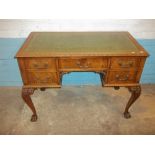 A DECORATIVE LEATHER INLAID DESK WITH CABRIOLE CLAW AND BALL LEGS