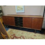 A RETRO TEAK LONG SIDEBOARD WITH FOUR DRAWERS H-84 W-221 D-45 CM