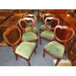 A SET OF SIX VICTORIAN MAHOGANY CROWN BACK DINING CHAIRS TOGETHER WITH A LATER CIRCULAR MAHOGANY