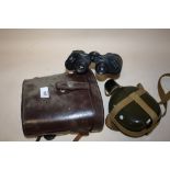 A CASED PAIR OF REGENT 10X50 BINOCULARS TOGETHER WITH A MILITARY STYLE FLASK