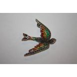 A PLIQUE-A-JOUR BROOCH IN THE FORM OF A BIRD IN FLIGHT