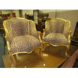 A PAIR OF GILT FRAMED LOUIS XV ARMCHAIRS IN A CONTEMPORARY LEOPARD UPHOLSTERY