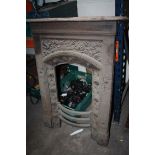 A CAST METAL FIRE SURROUND