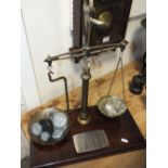 A SET OF VINTAGE BRASS AND MAHOGANY POSTAL SCALES WITH WEIGHTS