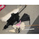 FOUR VINTAGE PARASOLS TOGETHER WITH AN OSTRICH FEATHER FAN