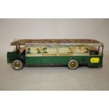 A VINTAGE FRENCH TIN PLATE WIND UP BUS TOY