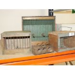 A COLLECTION OF SMALL ANIMAL TRAVEL CASES AND TRAPS