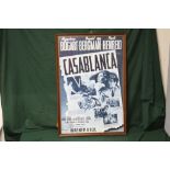 A LARGE REPRODUCTION FRAMED AND GLAZED ADVERTISING POSTER FOR WARNER BROS. 'CASABLANCA' OVERALL SIZE