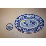 AN ORIENTAL BLUE AND WHITE OVAL DISH TOGETHER WITH A SILVER HANDPAINTED BLUE AND WHITE MINIATURE