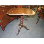 AN ANTIQUE PEDESTAL TRIPOD TABLE