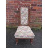 AN EDWARDIAN CARVED MAHOGANY PRAYER STYLE CHAIR