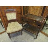 A CARVED MAHOGANY CHAIR AND AN OAK TROLLEY (2)