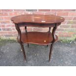 AN ANTIQUE MAHOGANY INLAID SHAPED TWO TIER TABLE W-89 CM A/F