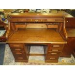 AN EARLY 20TH CENTURY OAK 'S' TAMBOUR ROLL TOP DESK