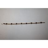 A 9 CARAT GOLD SMOKEY QUARTZ EIGHT STONE BRACELET A/F