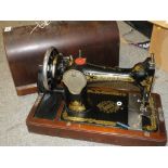 A CASED VINTAGE SINGER SEWING MACHINE