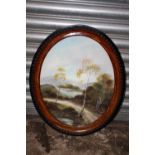 AN OVAL FRAMED AND GLAZED OIL ON BOARD DEPICTING A COUNTRY PATH - SIZE 51CM X 40CM