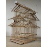 A WOODEN/CANE BIRD DISPLAY CAGE