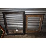 TWO GILT AND EBONISED WOODEN PICTURE FRAMES - LARGEST REBATE SIZE 65.5CM X 49CM - SMALLEST REBATE