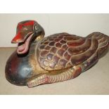 AN INDONESIAN STYLE CARVED HARDWOOD FIGURE OF A DUCK, LENGTH 33 CM