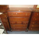 A STAG MINSTREL SEVEN DRAWER CHEST - FOUR HANDLES MISSING