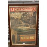 A REPRODUCTION FRAMED AND GLAZED LONDON RAILWAY INTEREST PRINT ENTITLED 'UNDERGROUND WINTERS