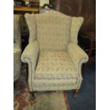 A VINTAGE WING - BACK ARMCHAIR WITH BALL AND CLAW FEET - A/F