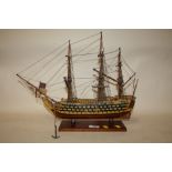 A HAND BUILT WOODEN MODEL OF A GALLEON, H 35.5 CM
