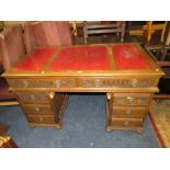 AN 'OLD CHARM' STYLE CARVED OAK LEATHER TOPPED TWIN PEDESTAL DESK H-79 W-138 CM