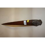A BLACK FOREST STYLE CARVER WOODEN PAGE TURNER IN THE FORM OF A GENTLEMAN