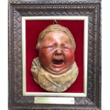 A LATE VICTORIAN PLASTER POLYCHROME BUST OF A CRYING BABY BY CHARLES JAMES SMITH, the painted bust