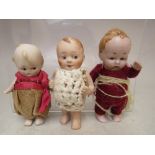 TWO EARLY 20TH CENTURY MINIATURE BISQUE KEWPIE DOLLS, tallest H 9 cm, together with a similar