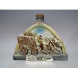 A VINTAGE SEALED CERAMIC 'HAROLDS CLUB' DECANTER OF BEAM 100 MONTHS OLD KENTUCKY STRAIGHT BOURBON