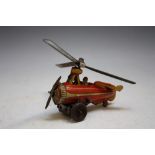 A VINTAGE GERMAN TIN PLATE CLOCKWORK HELICOPTER marked 'D.R.G.M. GERMANY', with key, L 10 cm