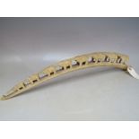 AN ANTIQUE IVORY CARVED TUSK ELEPHANT TRAIN, circa 1900 / 1910, L 54 cm